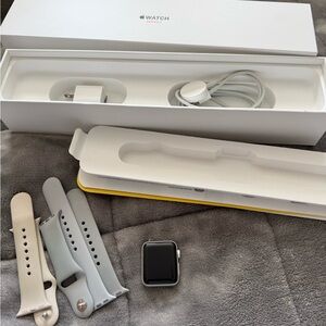 Apple Watch with Silver Case with Light Gray, Beige Bands